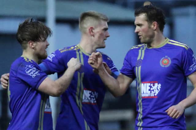 Rhys Davies, left, is congratulated by Marcus Day and Rob Youhill after netting a late goal to put Harrogate Railway 3-0 up against Clipstone. Picture: Craig Dinsdale