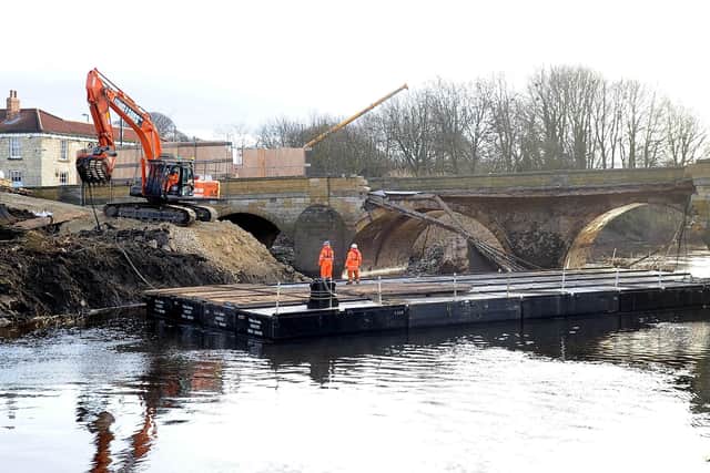 A floating pontoon was moved into position in February 2016  to help rebuild the 300 year old Tadcaster bridge that was damaged by the flooding of 2015. Picture James Hardisty
