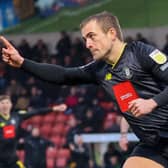 Alex Pattison celebrates after firing Harrogate Town into an early lead at Rochdale. Pictures: Matt Kirkham