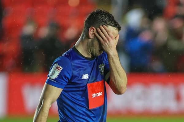 Harrogate Town captain Josh Falkingham cannot hide his disappointment after Exeter City nick a last-gasp winner at St James' Park. Picture: Matt Kirkham