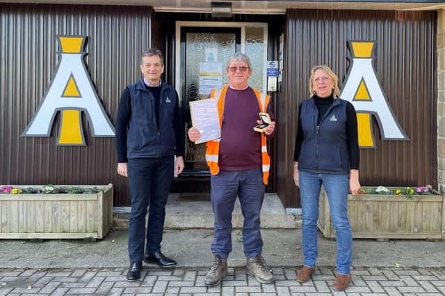 Mick Fryatt (centre) picked up an award for 25 years of service at Masham-based animal feed manufacturer I'Anson Brothers from directors Chris I'Anson and Sarah Richardson.
