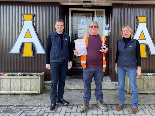 Mick Fryatt (centre) picked up an award for 25 years of service at Masham-based animal feed manufacturer I'Anson Brothers from directors Chris I'Anson and Sarah Richardson.
