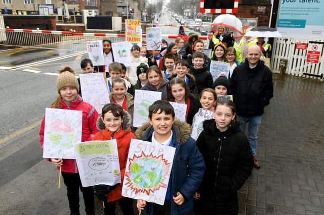 Starbeck Primary School pupils and Starbeck Residents Association demonstration at the level crossing in Starbeck. (Picture Gerard Binks)