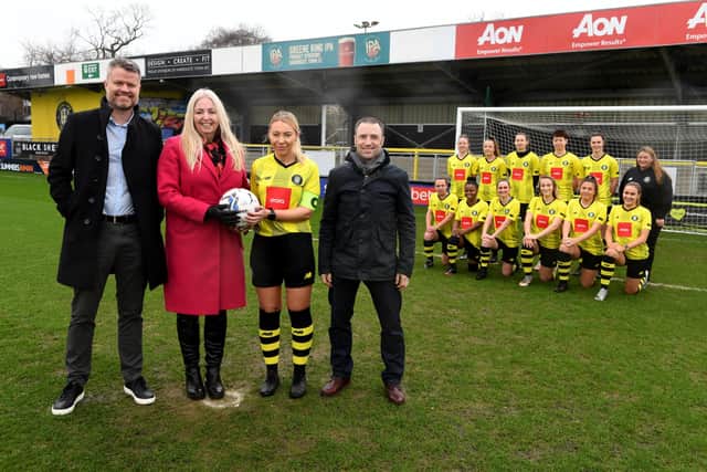 Aon plc has announced it is to sponsor the Harrogate Town AFC Ladies team. Pictured: Aon representatives James Fell, Carol Malt and Andy Hall with Town skipper Abbey Smith and the Harrogate Town ladies team, in front of the Aon stand at The EnviroVent Stadium in Harrogate. PHOTO: Gerard Binks.