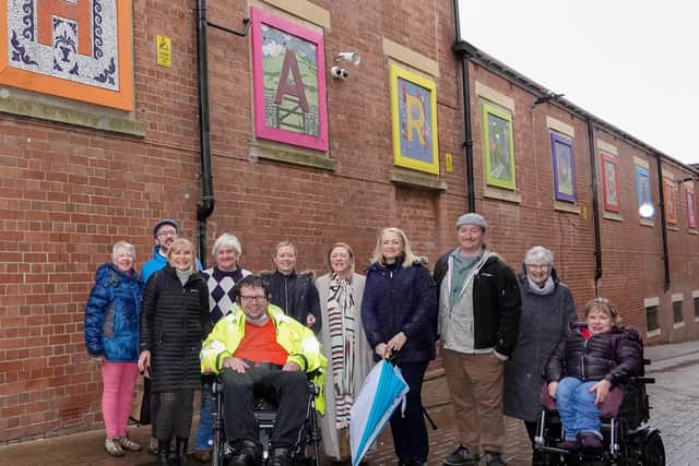 Work of Art! Harrogate BID Chair Sara Ferguson, sixth from left, Artizan International Founder Susie Hart MBE, fourth from right, and Douglas Thompson, third from right, pictured with Artizan International members and volunteers in front of their Harrogate letters.