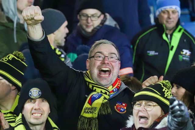 Harrogate Town supporter Jordan Ford, centre.