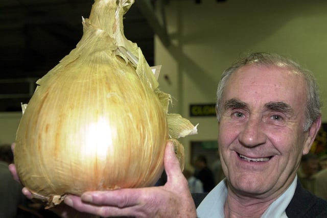 13 September 2002...Harrogate Autumn flower Show.Pictured Vincent Throup from Silsden who won heavy weight onion at the show.The onion weighed in at 5.435 KG.