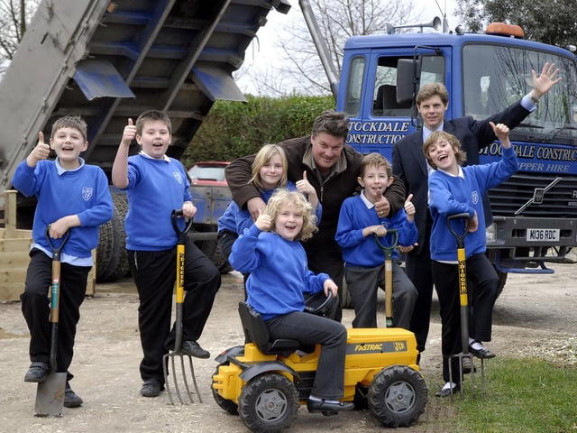 Stockdale Construction Ltd donates 12 tons of topsoil to Seamer and Irton Primary School for the new garden area planters. Pictured with the pupils are John Stockdale, director of Stockdale Construction, centre, and headmaster Jonathan Wanless, back.