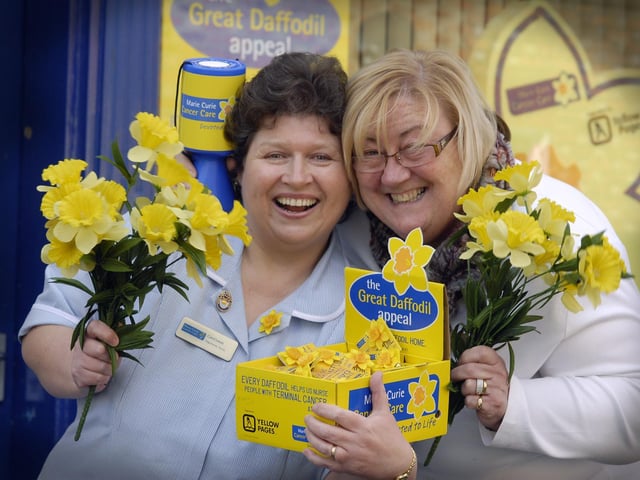 Marie Curie nurse Carol Lewis, left, and Selina Corser, fundraising office administrator, help launch the charity's Great Daffodil Appeal.