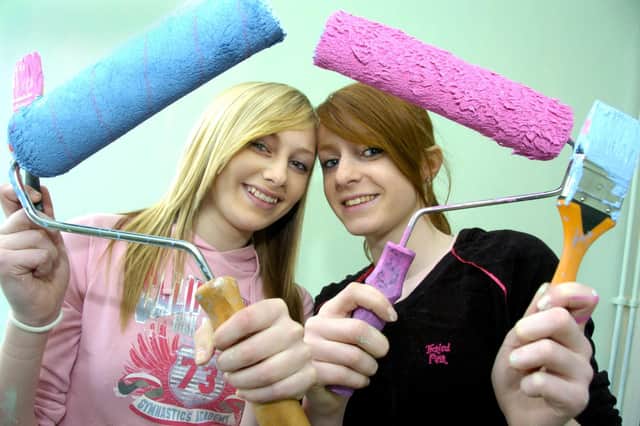 Pictured is Amber Atkinson, left, with Amy Fraser taking part in a decorating day at Scarborough Gym Academy's new premises.