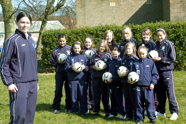 Girls Soccer School of Excellence coach Sam Lee is pictured with Scarborough based members of the academy.