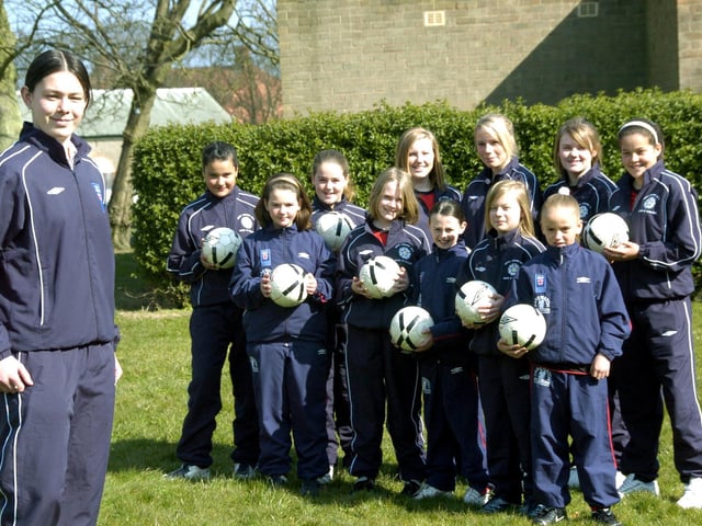 Girls Soccer School of Excellence coach Sam Lee is pictured with Scarborough based members of the academy.
