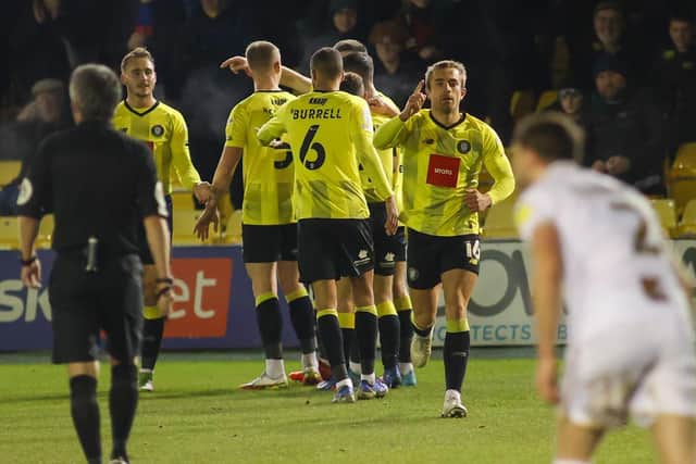 Harrogate Town players celebrate after taking a 23rd-minute lead against Port Vale at the EnviroVent Stadium.