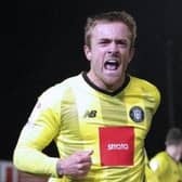 Alex Pattison celebrates after firing Harrogate Town into a 23rd-minute lead against Port Vale on Tuesday evening. Pictures: Matthew Appleby