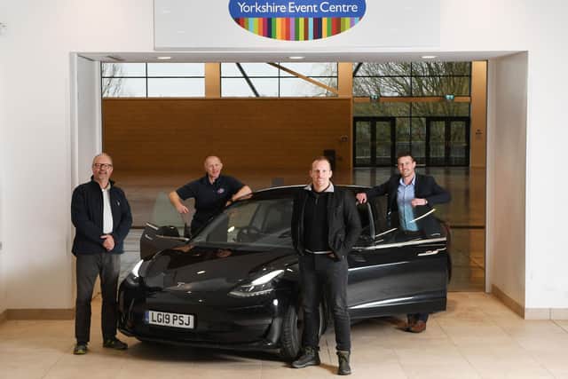 Fully Charged LIVE North 2023 - (left to right) Robert Llewellyn (Presenter), Richard Moorhouse (Operations Manager at the YEC), Dan Caesar (Joint CEO of Fully Charged Live) and Ben Chatburn (Sales Manager at the YEC)