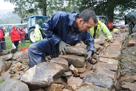 24th September 2012.Nidderdale Show, Pateley Bridge.Pictured Neil Beasley from Harrogate taking part in the drystone walling at the show in the pouring rain.Picture by Gerard Binks.