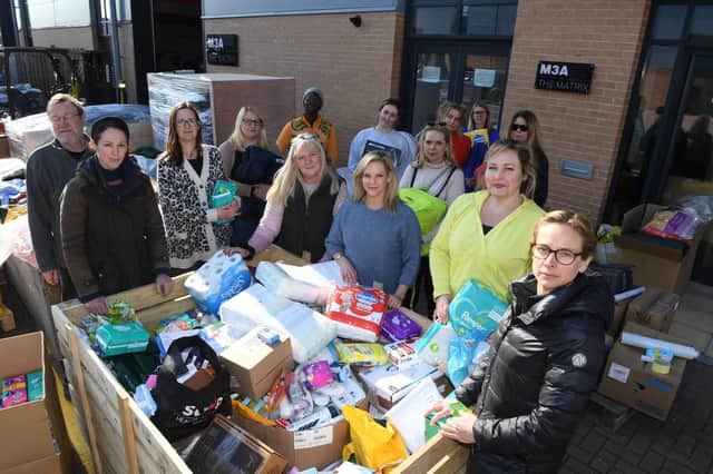 Helping Ukraine - Whitney Vauvelle (middle) with helpers sorting out donations for Ukraine at White Horse Machinery at Hornbeam Park in Harrogate. (Picture Gerard Binks)