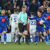 Harrogate Town players show their frustration with referee Darren Handley following his decision to award Tranmere Rovers a second-half penalty during Tuesday night's League Two clash at Prenton Park. Pictures: Matt Kirkham