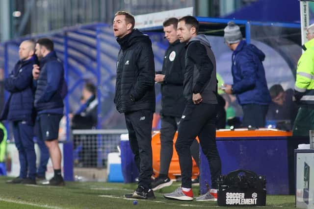 Simon Weaver watches on from his technical area during Harrogate Town's 2-0 loss at Tranmere Rovers.