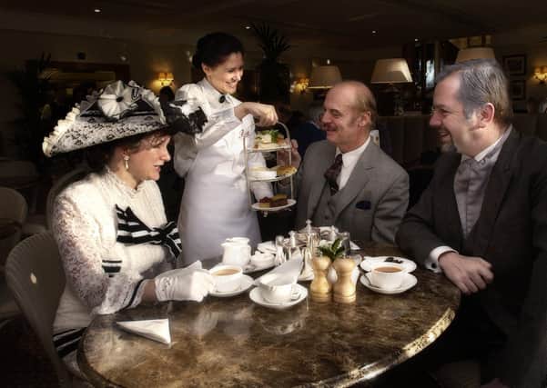 Catherine Noland, Derek Newton and Oliver Longstaff (right) of the Phoenix Players are served by Marisa Cabeza in Bettys Tearooms.