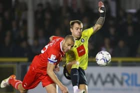 Harrogate Town midfielder Alex Pattison competes for possession with Leyton Orient's Darren Pratley during Tuesday night's League Two clash at Wetherby Road. Picture: Matt Kirkham