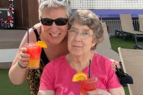 Karen and her mum enjoy cocktails on holiday.