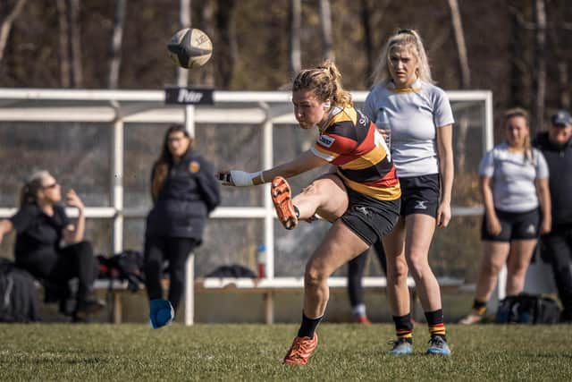 Lauren Bolger kicks a conversion for the home side.