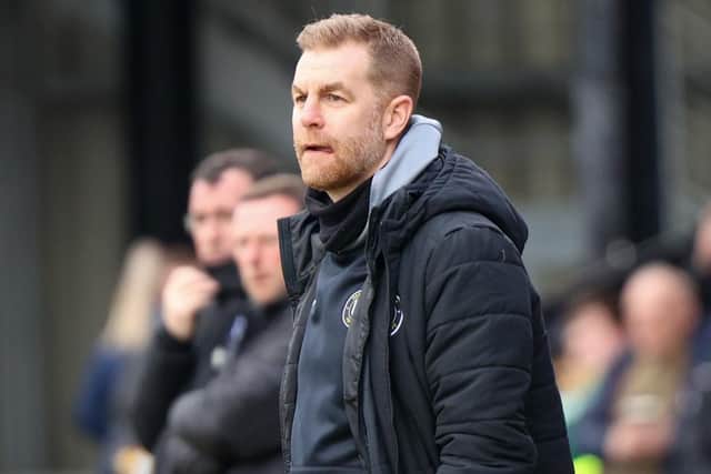 Harrogate Town manager Simon Weaver watches on from the sidelines.