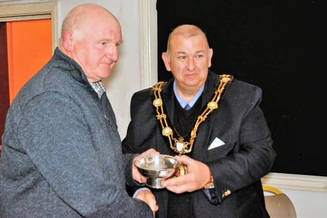 Councillor Stuart Martin accepting the John Whitehead Bowl from Ripon Mayor Eamon Parkin, on behalf of the 2018 Ripon Armistice Commemorations.