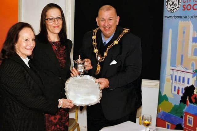 Grantley Hall owner, Valeria Sykes, and Senior Architect Anita, Rebaudo of Bowman Riley accepting the Hazzard Cup and the Helen Whitehead Salver from Ripon Mayor, Councillor Eamon Parkin.