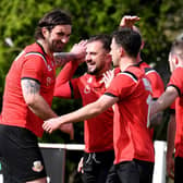 Knaresborough Town players celebrate after Sam Cook, left, headed them into a first-half lead during Saturday's 4-0 home win over Bottesford Town. Pictures: Gerard Binks