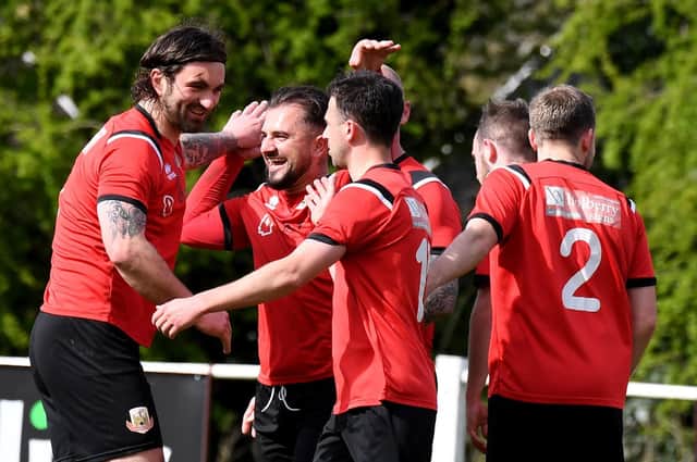 Knaresborough Town players celebrate after Sam Cook, left, headed them into a first-half lead during Saturday's 4-0 home win over Bottesford Town. Pictures: Gerard Binks