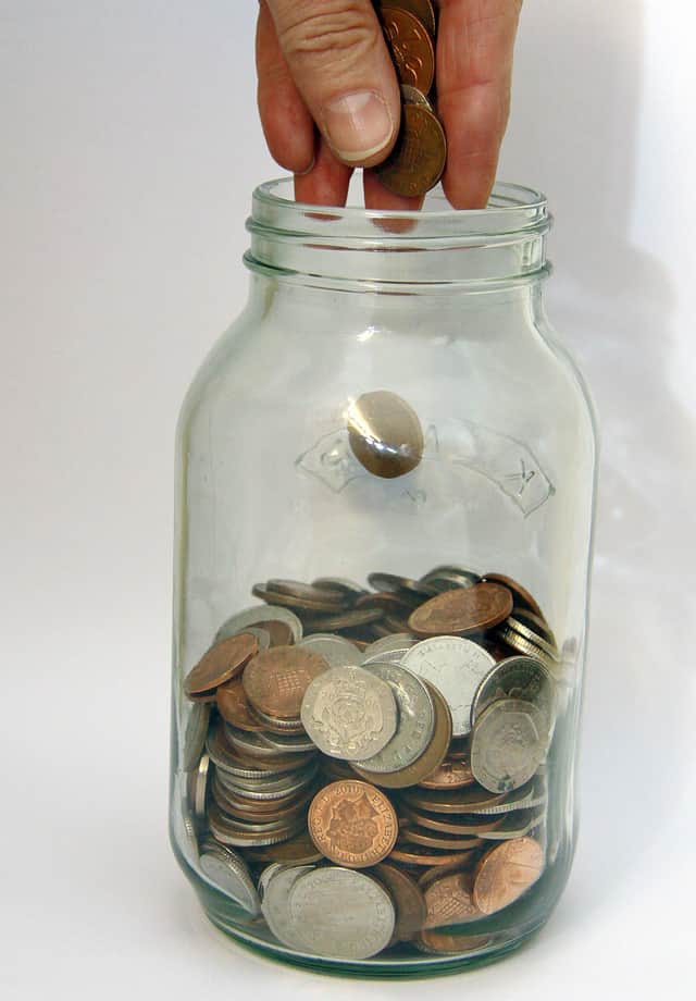 Stock photo glass Money bottle. Saving pennies
