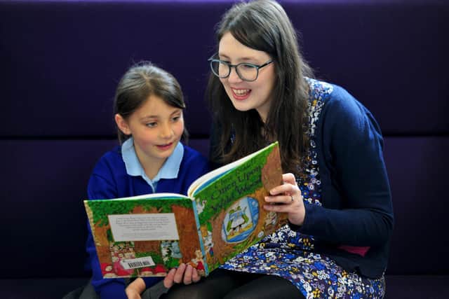 A truly family shop - Georgia Duffy of Imagined Things Bookshop with children taking part in her reading books scheme at New Park Primary Academy in Harrogate in 2019.