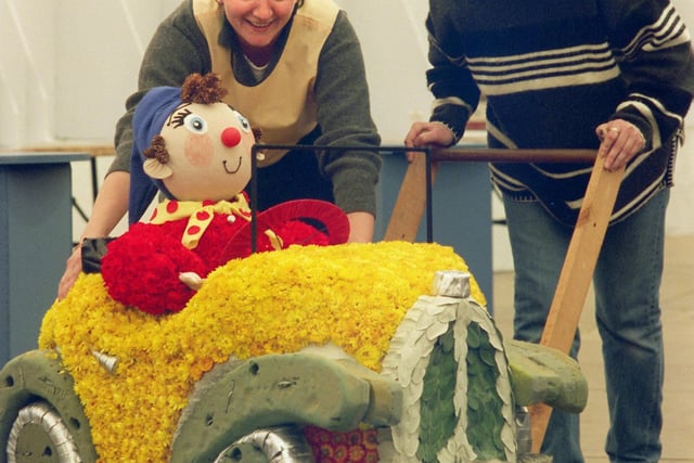 Arriving in his little yellow car at the Harrogate Spring Flower show is Noddy pushed by Tracey Wilson (left) and Sophie Beevers  students at Shipley College for their  flower arrangement  of Noddy by Enid Blyton.