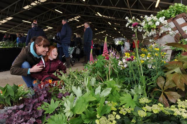 22nd May 2021Flower Show 2021 Spring Essentials, Harrogate.Pictured Jenny Marshall and her 6 year old daughter Poppy take a look at one of the flower displays at the showPicture Gerard Binks