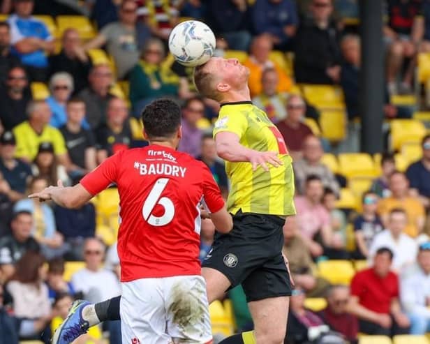 Mark Beck climbs highest to win a header during Harrogate Town's 4-1 home defeat to Swindon Town. Picture: Matt Kirkham