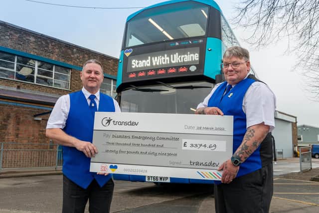 Transdev’s Yorkshire-based Coastliner bus drivers Shaun (left) and Bari with a cheque for £3,374.69 for the Disasters Emergency Committee’s Ukraine appeal