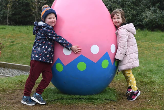 Four-year-old twins Cyril and Lyra Semprini pictured with a giant Easter Egg