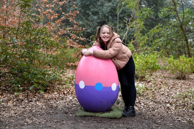 Nine-year-old Scarlet Horton pictured with a giant egg at RHS Garden Harlow Carr
