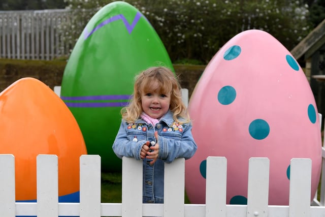 Four-year-old Jessica Hainsworth with the giant eggs at the East Egg Hunt at RHS Gardens Harlow Carr