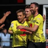 Rory McArdle, right, is congratulated by his Harrogate Town team-mates after heading his side into a 2-0 lead against Carlisle United. Picture: Matthew Appleby