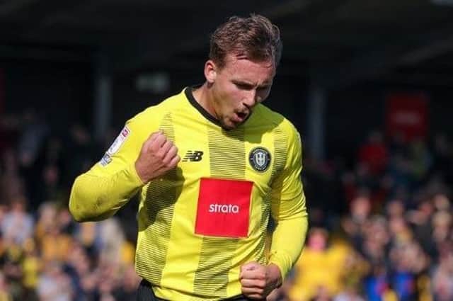 Jack Diamond celebrates after putting Harrogate Town 3-0 up against Carlisle United in stoppage-time. Picture: Matthew Appleby