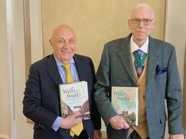 Book signing - Harrogate historian Malcolm Neesam with William Woods during an event this week as part of Woods store's week of anniversary celebrations.