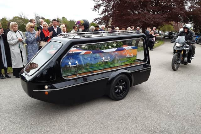 The late Harrogate gallery owner Andrew Stewart was carried to Stonefall Chapel in a brilliantly-painted coffin.