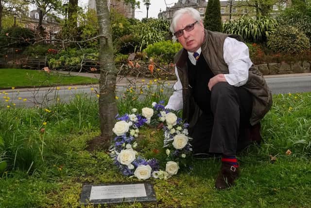 Harrogate businessman and thalidomider Guy Tweedy lays a wreath at the foot of the tree he planted to remember those who died from the so-called 'wonder drug'