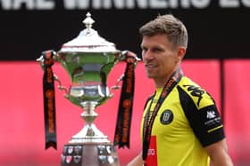 Lloyd Kerry at Wembley Stadium with the 2019/20 National League play-off final winners' trophy. Picture: Getty Images