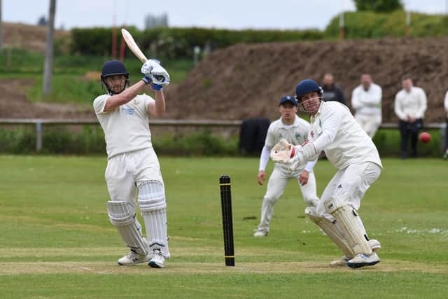 Goldsborough batsman Luke Boniface hits out with Birstwith wicket-keeper James Riley watching on.