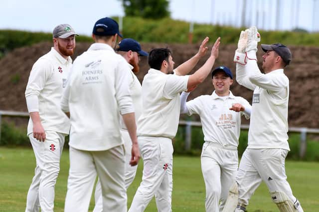 Birstwith CC celebrate an early wicket for George Hirst, centre, during Saturday's Theakston Nidderdale League Division One win over Goldsborough. Pictures: Gerard Binks
