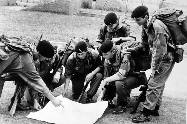 Harrogate. 8th August 1974

The four young soldiers from the Army Apprentices' College, Harrogate, who are to take part in Exercise Parashot with other units of the British Army, are instructed by Sgt.-Major John Hagard (left) and Sgt.-Major Bill Jamieson.  From the left, they are:  A./T. Malcom Whitehead, A./T. L./Cpl. Philip Legrove, A./T. L./Cpl. John McEwan and A./T. Sgt. John Hickman.